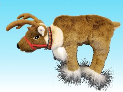A plush reindeer toy with brown fur, white accents, and antlers, wearing a decorative collar and red harness, standing on legs adorned with fluffy white and black material, against a blue background.