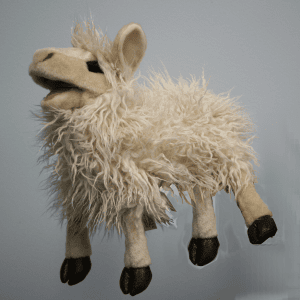 A fluffy, cream-colored llama puppet with shaggy fur, black hooves, and an open mouth, set against a plain light gray background.