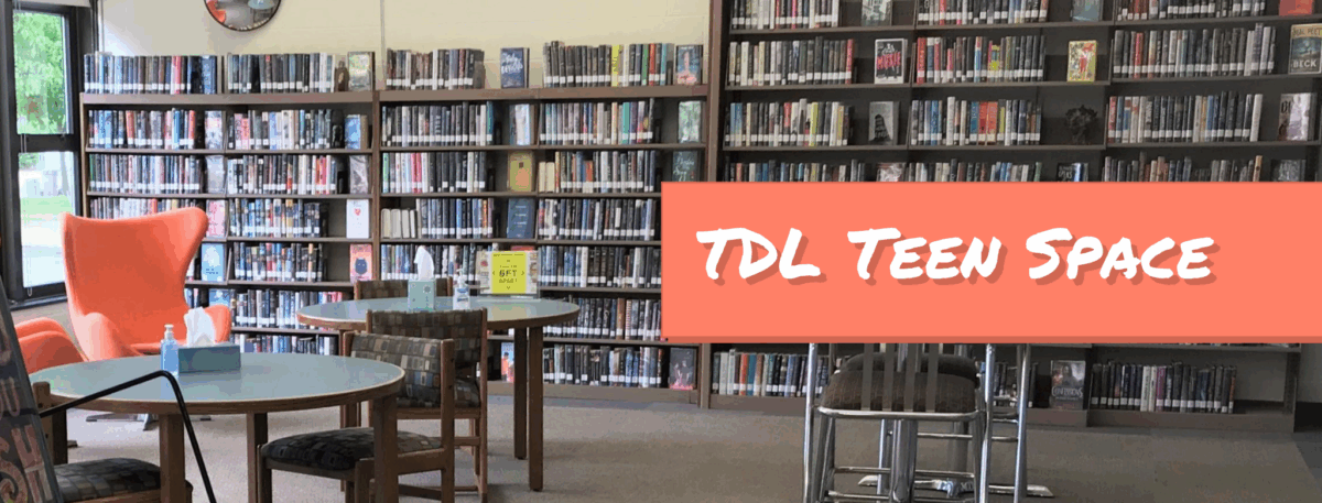 A library room with bookshelves filled with books, tables and chairs, an orange lounge chair, and a large sign that reads TDL Teen Space.