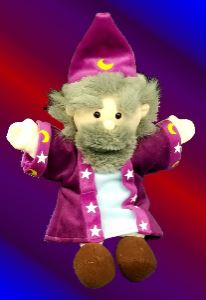 A plush wizard puppet with a pointy purple hat, gray hair and beard, wearing a purple robe with stars and crescent moons, and brown shoes, against a red and blue gradient background.
